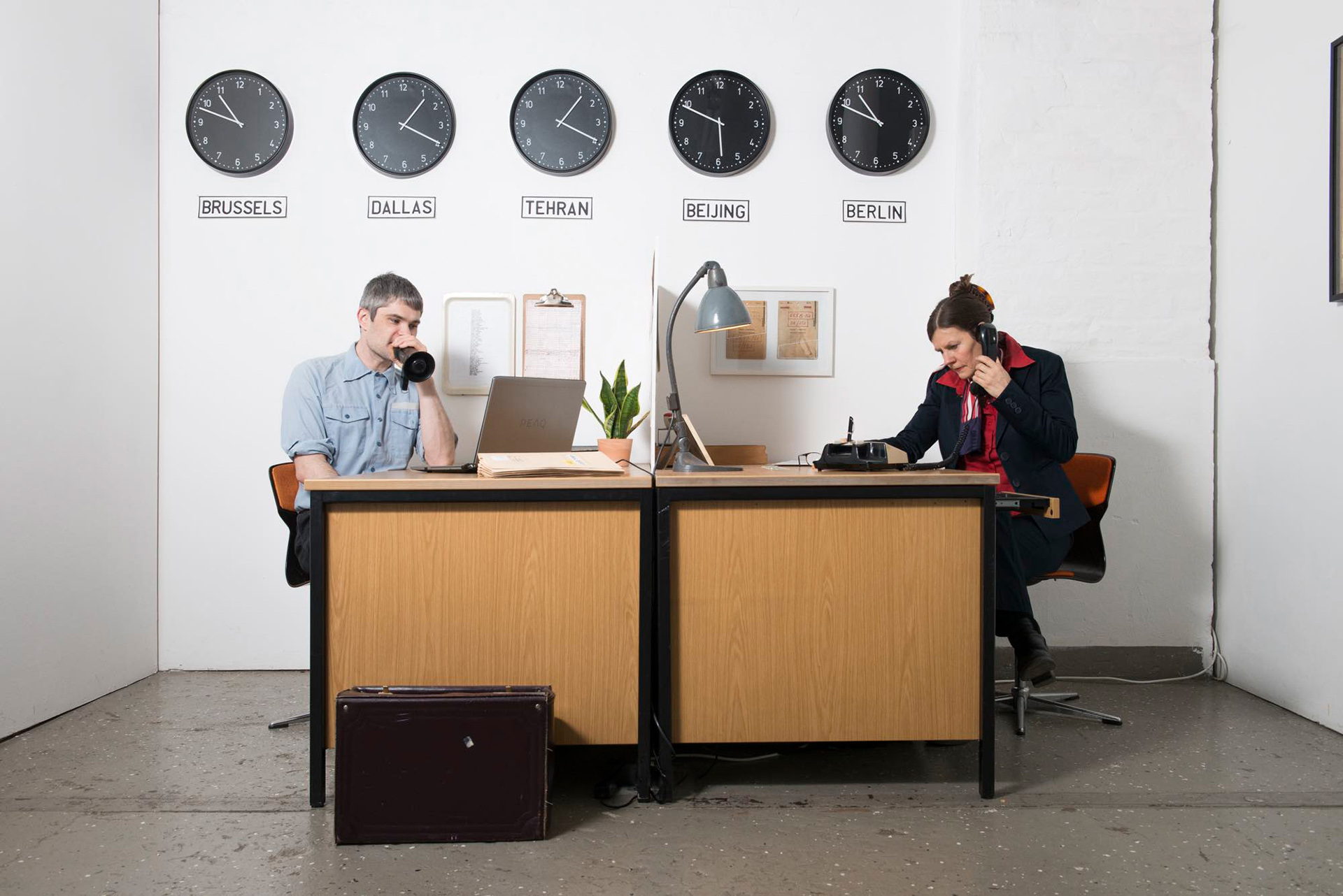 Office for Joint Administrative Intelligence performance image. Two people, on man one woman sitting across from one another in a cold oldish office space